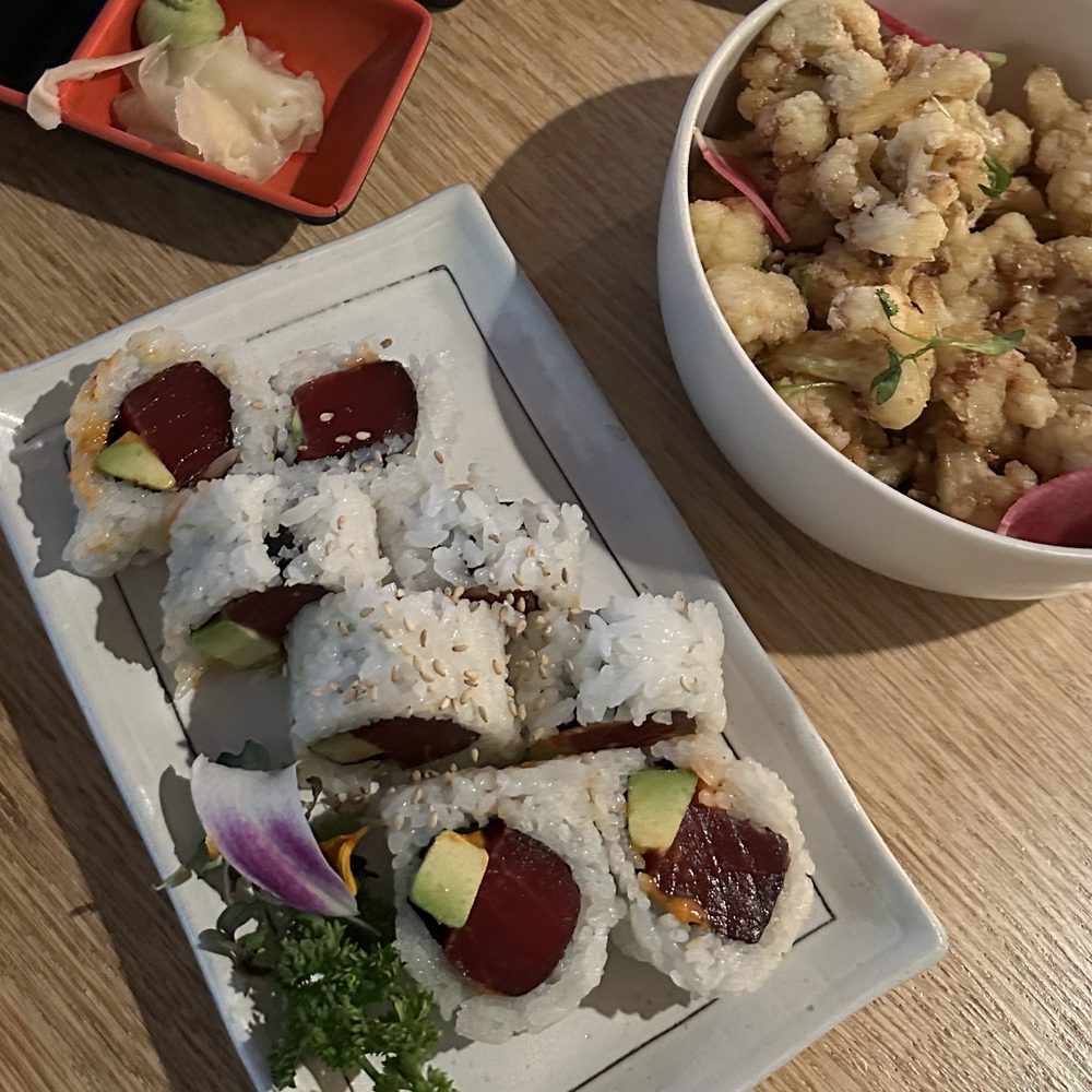 Spicy tuna roll and hot honey cauliflower which Spicy tuna roll and hot honey cauliflower which