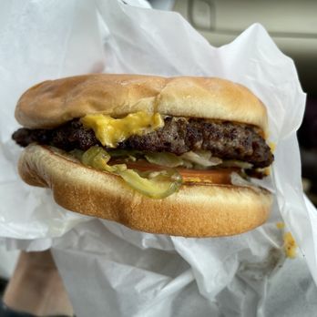 Crow's Burger Shop - a hand holding a hamburger - Burgers Near Me - Belton, Texas Crow's Burger Shop - a hand holding a hamburger - Burgers Near Me - Belton, Texas