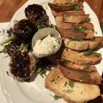 Moonshine Grill - Roasted garlic bulbs, goat cheese, crostini - Southern Near Me - Austin, Texas