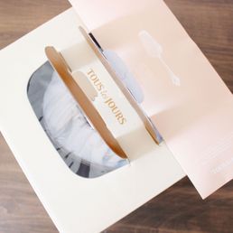 Cake box with cake knife, candles and matches