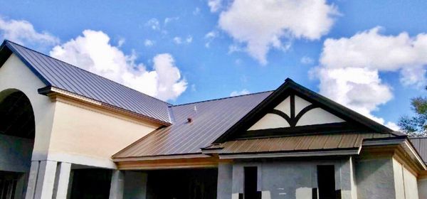 Susan McCarthy Roofing Contractor Logo