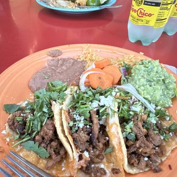 Que Onda Tacobar - Tacos de Costra Specialty with refried beans and Spanish rice with pickled carrots and guacamole. - Tacos Near Me - Vacaville, California Que Onda Tacobar - Tacos de Costra Specialty with refried beans and Spanish rice with pickled carrots and guacamole. - Tacos Near Me - Vacaville, California