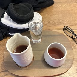 This is how they serve your coffee: a wooden tray customized to fit the coffee carafe, a glass of water, and your coffee mug. This is how they serve your coffee: a wooden tray customized to fit the coffee carafe, a glass of water, and your coffee mug.
