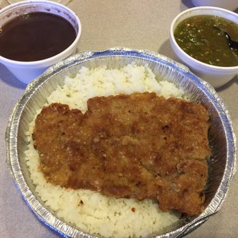 El Colmao - Bistec Empanizado served with a generous helping of garlic rice & black beans. The quality of the meat is "iffy". - Cuban Near Me - Los Angeles, California