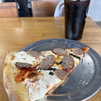 Ninos Bistro Express - Margarita pizza with added sausage. - Italian Near Me - Tinton Falls, New Jersey Ninos Bistro Express - Margarita pizza with added sausage. - Italian Near Me - Tinton Falls, New Jersey