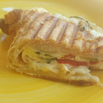 Cafe Soleil - Half of the egg, grilled veggies, Swiss cheese toasted croissant - Bakeries Near Me - St. Pete Beach, Florida