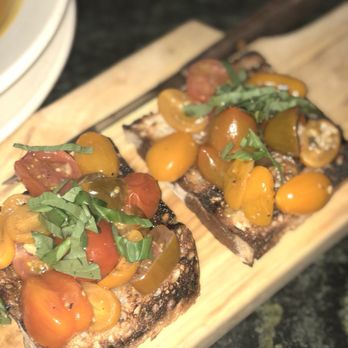 Pangea - two slices of toasted bread topped with vegetables - Italian Near Me - New York, New York Pangea - two slices of toasted bread topped with vegetables - Italian Near Me - New York, New York