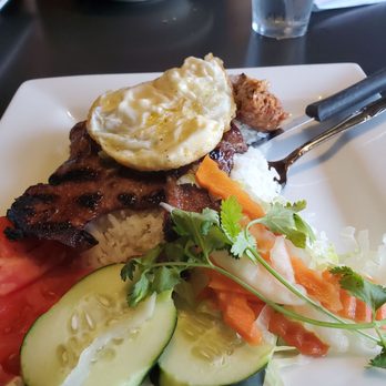 Saigon Restaurant - Grilled Pork chop with sausage and topped with a fried egg - Vietnamese Near Me - Omaha, Nebraska Saigon Restaurant - Grilled Pork chop with sausage and topped with a fried egg - Vietnamese Near Me - Omaha, Nebraska