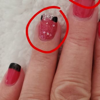 Durbin Nail Spa - Chipped after 1 week on left hand. Notice next finger over....tip was supposed to be sparkle black, but she couldn't get even that right - Nail Salons Near Me - St. Johns, Florida