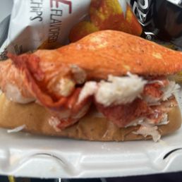 Lobster dog--bun with pieces of lobster and a container of warm butter Lobster dog--bun with pieces of lobster and a container of warm butter