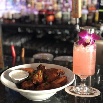 Smith & Kings - The 10 for $9 wings! Pictured with the hot wings, it's got a kick so dip in the ranch that accompanies it. - Cocktail Bars Near Me - Honolulu, Hawaii