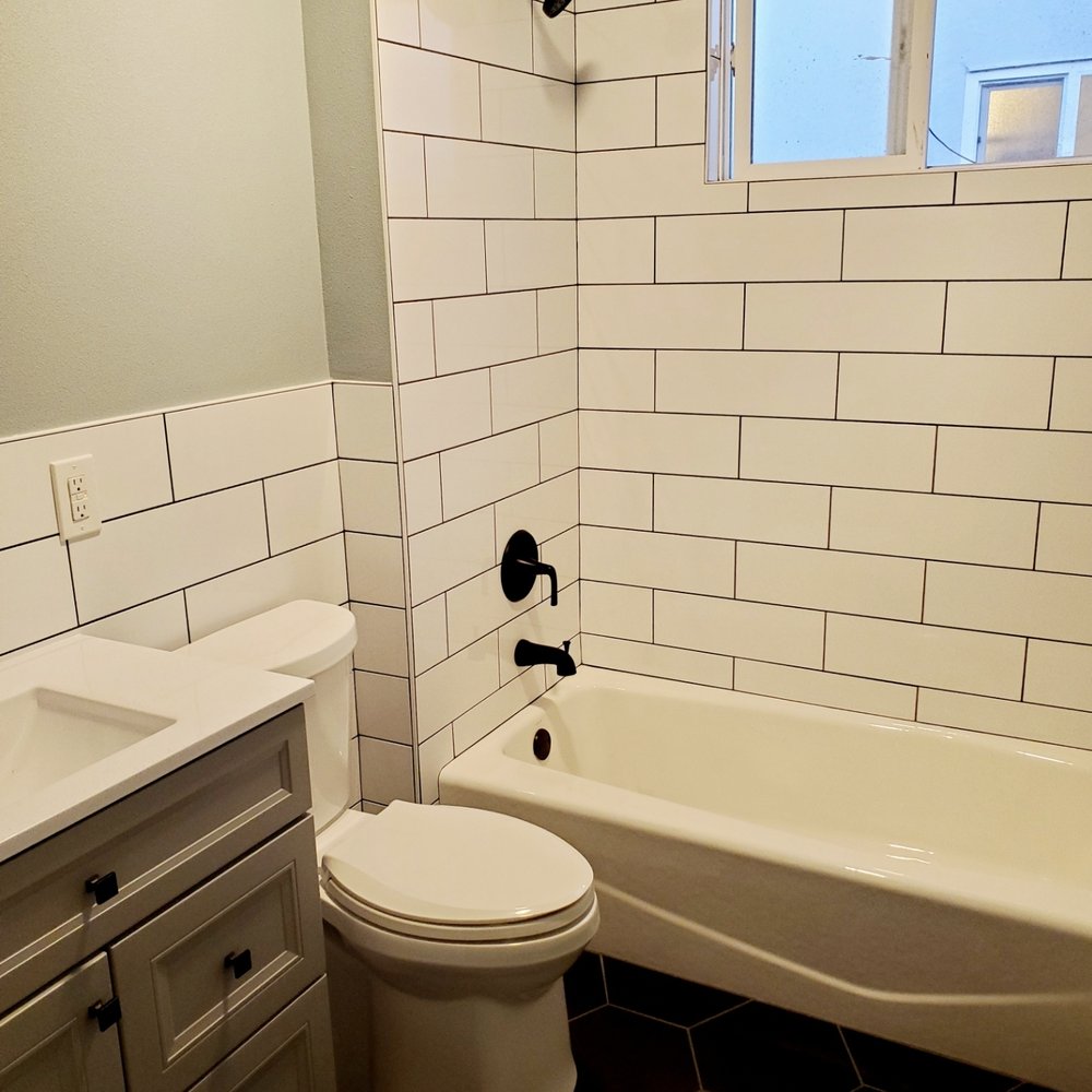 CalBay Remodeling and Construction - a bathroom with a toilet, tub, and sink - General Contractors Near Me CalBay Remodeling and Construction - a bathroom with a toilet, tub, and sink - General Contractors Near Me