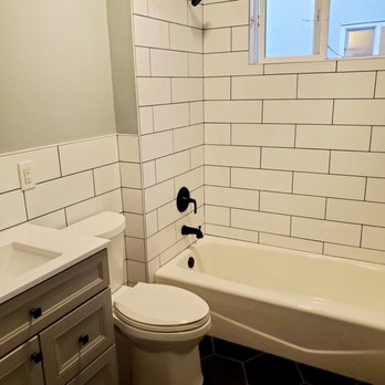 CalBay Remodeling and Construction - a bathroom with a toilet, tub, and sink - General Contractors Near Me CalBay Remodeling and Construction - a bathroom with a toilet, tub, and sink - General Contractors Near Me