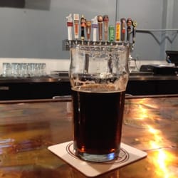 Three Sheets Craft Beer Bar - Best seat in the house. 12 of the 27 taps....