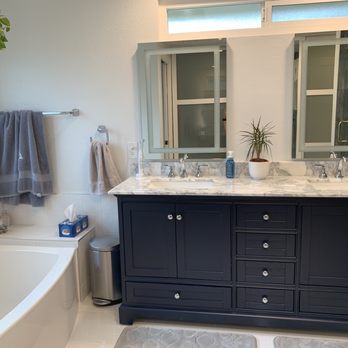 MPH Construction - New everything - tub with boxed ledge, navy blue vanity, mirrors with built in LED, fixtures and flooring. - General Contractors Near Me - Irvine, California