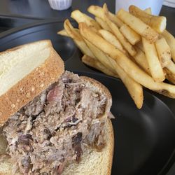 Pulled pork sandwich and fries