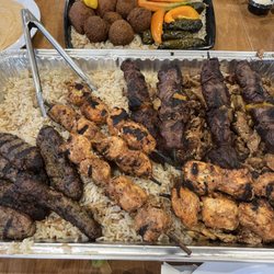 Zaytoon Mediterranean - Bed of rice under chicken shawarma, chicken kabob, beef kabob, shish kafta