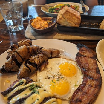 St. Anselm - Steak and eggs with some bacon and biscuit in the background. The bearnaise sauce was amazing! - Steakhouses Near Me - Washington, DC, District of Columbia