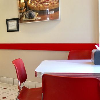 Domino's Pizza - a table and chairs in a restaurant - Chicken Wings Near Me - Avon, Colorado Domino's Pizza - a table and chairs in a restaurant - Chicken Wings Near Me - Avon, Colorado