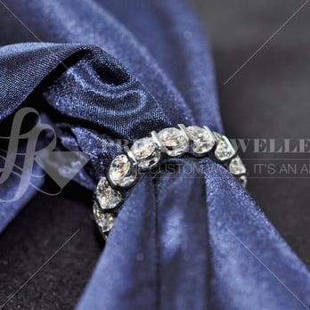 LL Private Jewellers - Diamond eternity wedding band containing 18 round brilliant cut diamonds. The diamonds are tension set. - Jewelry Near Me - Vancouver, British Columbia LL Private Jewellers - Diamond eternity wedding band containing 18 round brilliant cut diamonds. The diamonds are tension set. - Jewelry Near Me - Vancouver, British Columbia
