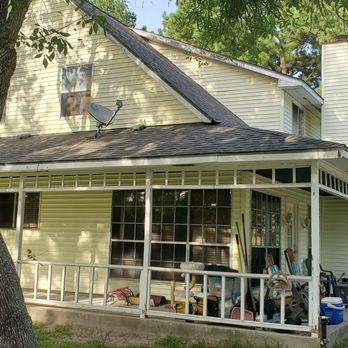 SLM Construction Services - two people walking in front of a house - General Contractors Near Me - Cypress, Texas SLM Construction Services - two people walking in front of a house - General Contractors Near Me - Cypress, Texas