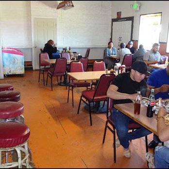 Mela's Mexican Restaurant - As you walk into the restaurant, you'll notice the bar, and the dining room, furnished with tables and chairs. - Mexican Near Me - Marysville, California