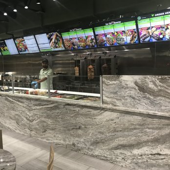 East Side Shawarma - a man standing in front of the counter - Mediterranean Near Me - Windsor, Ontario East Side Shawarma - a man standing in front of the counter - Mediterranean Near Me - Windsor, Ontario