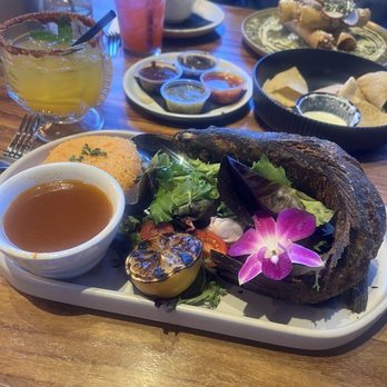 La Frida Mexican Grill & Seafood - Rick fish served w fish broth. Spanish rice , n a bed of green salad - Mexican Near Me - Tucson, Arizona