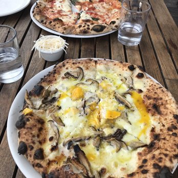 Nomad Pizza - Margherita pie in the distance, tartufo pie up close - Pizza Near Me - Princeton, New Jersey Nomad Pizza - Margherita pie in the distance, tartufo pie up close - Pizza Near Me - Princeton, New Jersey