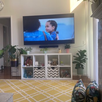 Big Boy TV Mounting - Mounted TV with wires in the wall. The single Wire to the right is my tv antenna which can't be put in the wall. Flawless job! - TV Mounting Near Me Big Boy TV Mounting - Mounted TV with wires in the wall. The single Wire to the right is my tv antenna which can't be put in the wall. Flawless job! - TV Mounting Near Me