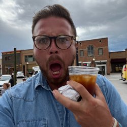 Cafe Kape Panaderia - Me and my coffee and the wrapper that use to house the greatest cream cheese pastry I've ever had!!!