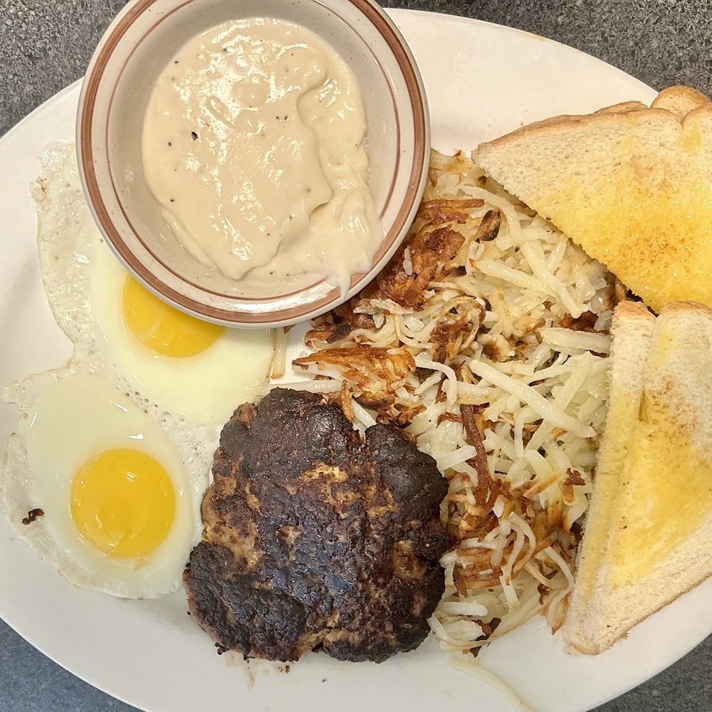 Ferguson's Cafe - Sausage Patty, sunny-side up eggs, toast, and hash browns, with a side of gravy. - Cafes Near Me - Spokane, Washington Ferguson's Cafe - Sausage Patty, sunny-side up eggs, toast, and hash browns, with a side of gravy. - Cafes Near Me - Spokane, Washington