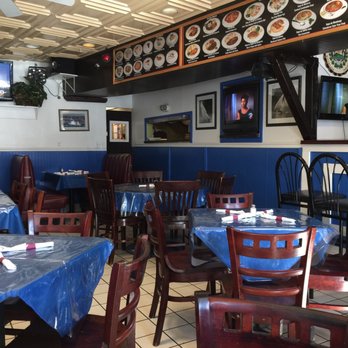 Las Delicias Restaurant - tables and chairs with blue tablecloths - Latin American Near Me - Annapolis, Maryland