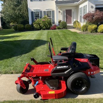 JQ O’Neill Consulting - a lawn mower parked in front of a house - Lawn Services Near Me JQ O’Neill Consulting - a lawn mower parked in front of a house - Lawn Services Near Me