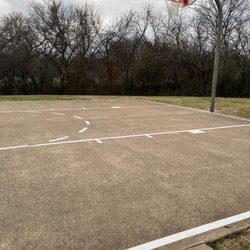 Kiowa Park - Outdoor Basketball court, 2 Tennis courts in the background behind trees