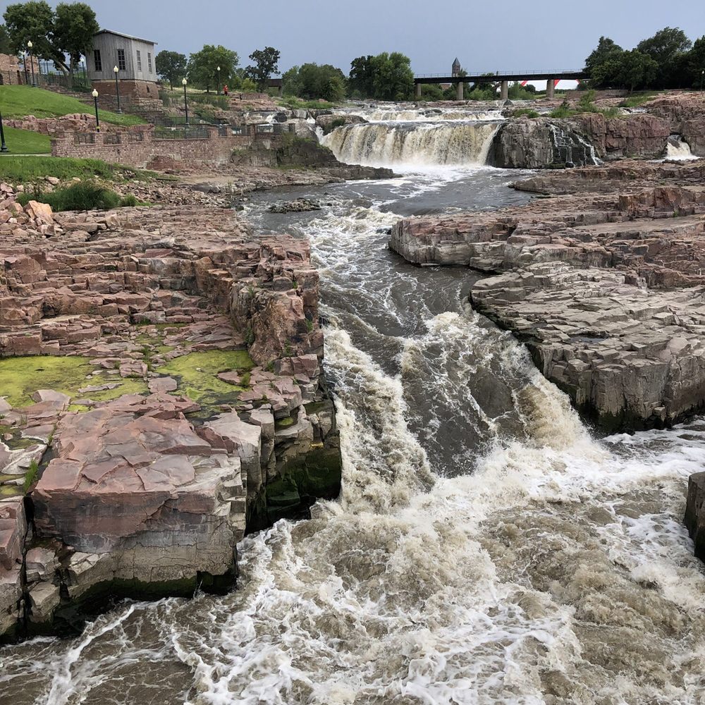 Falls Park - Walking bridge overlooking the falls - Parks Near Me - Sioux Falls, South Dakota Falls Park - Walking bridge overlooking the falls - Parks Near Me - Sioux Falls, South Dakota