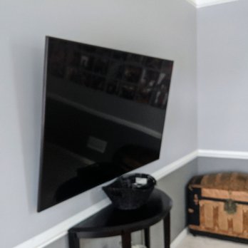 The TV Pro - Larger TV at 65" mounted perfectly on the wall. Mike even threw in a wall mount as part of an install special! - Home Theatre Installation Near Me