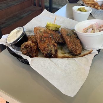 Nashbird - A closer view of the buttermilk ranch jumbo wings and the vinegar slaw. - Southern Near Me - Oklahoma City, Oklahoma Nashbird - A closer view of the buttermilk ranch jumbo wings and the vinegar slaw. - Southern Near Me - Oklahoma City, Oklahoma