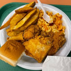 2 piece dark meat with macaroni and potato wedges.