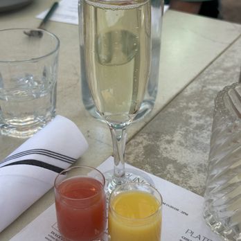 Benchmark - This is a "Tropical Charli" Mimosa...sparkling wine with  1/2 OJ &  1/2 Guava juice...made up by my daughter, Charli Rose! - New American Near Me - Santa Ana, California