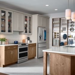 Santa Cruz Cabinets - Traditional kitchen with dove colored upper cabinets and walnut lower cabinets.