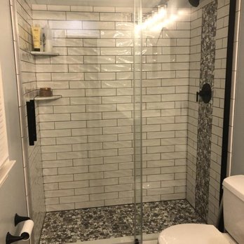 Sterling General Contractors - a shower and toilet in a bathroom - General Contractors Near Me - Frederick, Maryland Sterling General Contractors - a shower and toilet in a bathroom - General Contractors Near Me - Frederick, Maryland