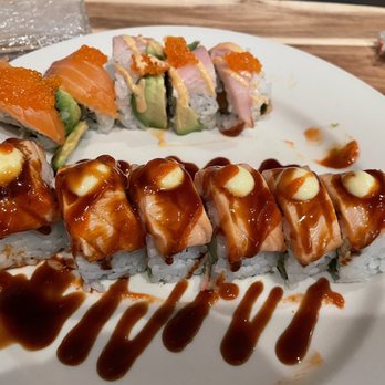 Sunh Fish - Front is crazy salmon roll. With a dollop of Japanese mayonnaise, lightly sear with a torch and then add eel sauce and Sriracha. - Seafood Markets Near Me - Sacramento, California Sunh Fish - Front is crazy salmon roll. With a dollop of Japanese mayonnaise, lightly sear with a torch and then add eel sauce and Sriracha. - Seafood Markets Near Me - Sacramento, California