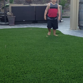 Anchor Turf Company - Our little dude playing on the awesome new turf. (with his new hat) - Artificial Turf Near Me Anchor Turf Company - Our little dude playing on the awesome new turf. (with his new hat) - Artificial Turf Near Me
