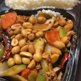 a tray of stir fried vegetables and cashews a tray of stir fried vegetables and cashews