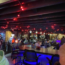 Large L shaped bar with limited booth and high top tables as well. Large L shaped bar with limited booth and high top tables as well.