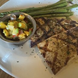 Mahi mahi with mango salsa and asparagus. Mahi mahi with mango salsa and asparagus.