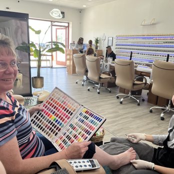 369 Nail Bar - Mother getting a pedicure and choosing a color :) - Eyelash Service Near Me - Centennial, Colorado