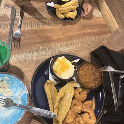 Blue Crab Grill - Half and half fish and shrimp with cheese grits and baked beans Also pictured kids fish with Mac n cheese