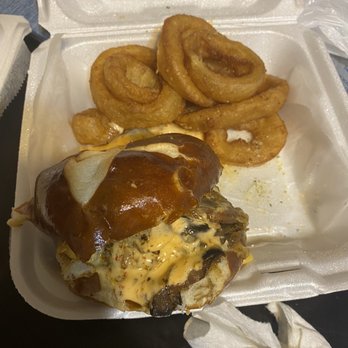 Burger Culture - Cajun burger w/ sauce and onion rings ordered on pretzel bun. - Burgers Near Me - Tampa, Florida Burger Culture - Cajun burger w/ sauce and onion rings ordered on pretzel bun. - Burgers Near Me - Tampa, Florida